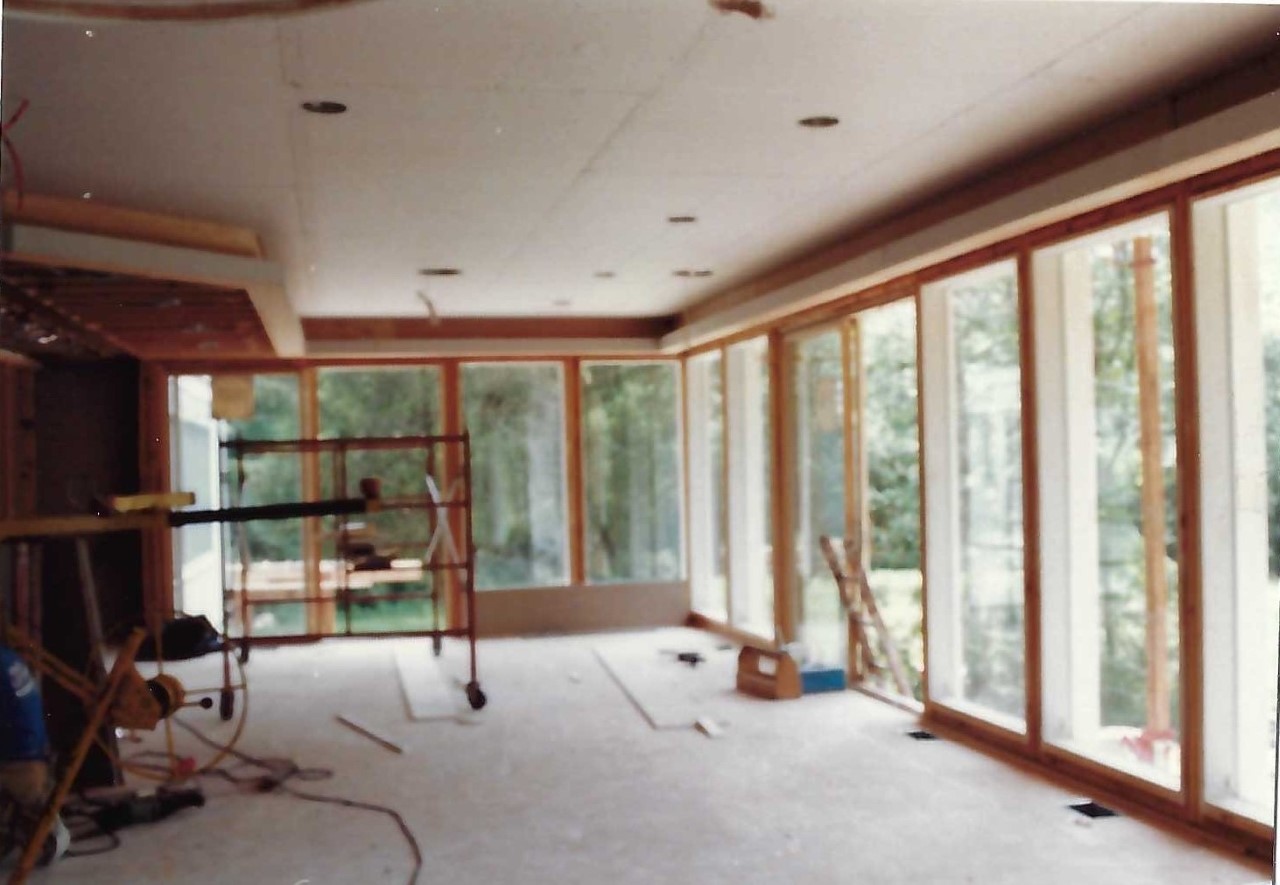 home addition with floor to ceiling windows