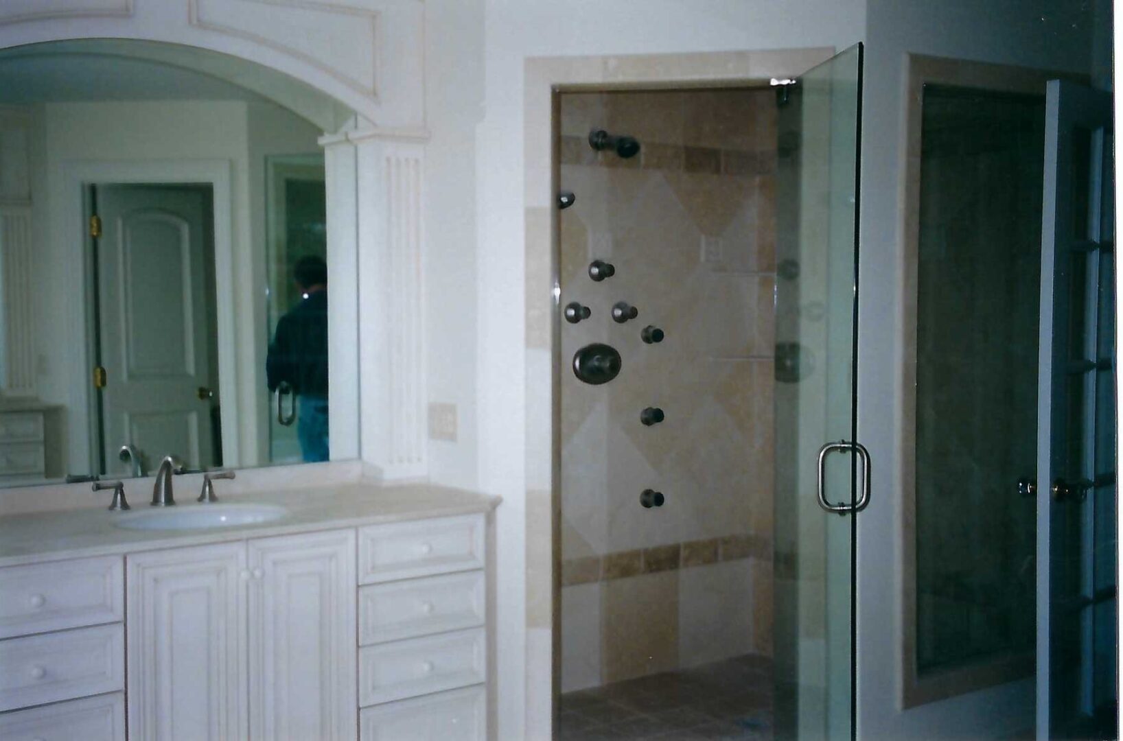 a bathroom with a shower enclosure