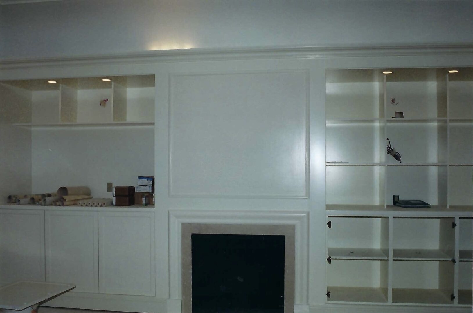 built-in shelves and a fireplace